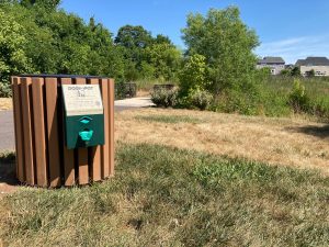 Brambleton-Pet-Waste-Station-Installed-next-to-Creek-and-Bridge-2024-300×225